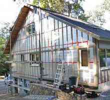 Затопляне на дървената къща отвън: технология и изолационни характеристики